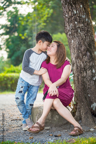 Happy Asian family ,mother with her son at park
