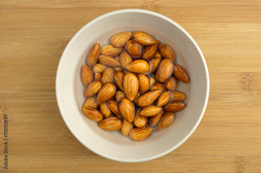 Almonds soaking in a bowl of water Almonds soaking in a bowl of water