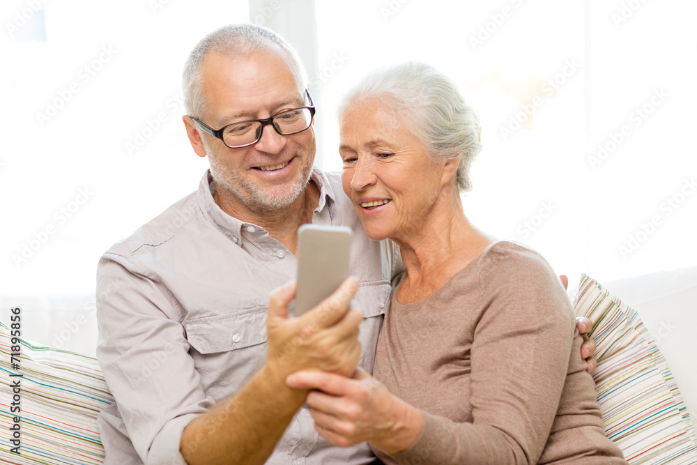 happy senior couple with smartphone at home happy senior couple with smartphone at home
