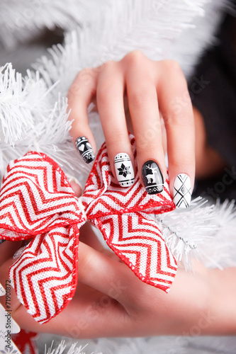 Beautiful manicured and gel polished hand for winter