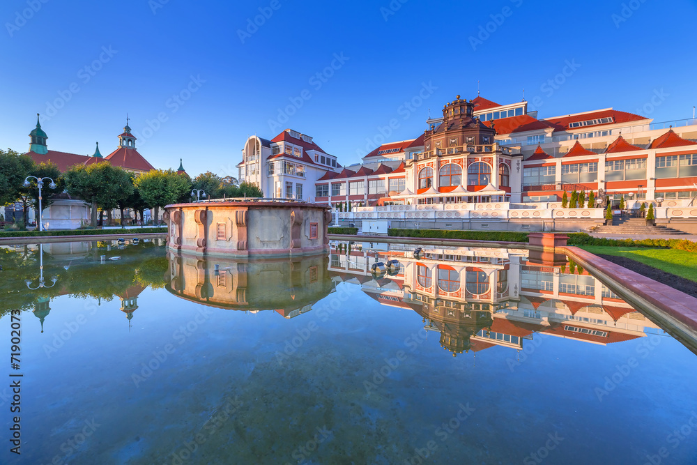 Baltic architecture of Sopot reflected in the fountain, Poland