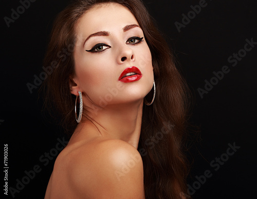 Sexy makeup female with red lipstick looking hot on black