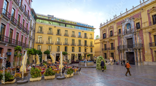 MALAGA - JUNE 12: City street view with cafeteria terraces and s