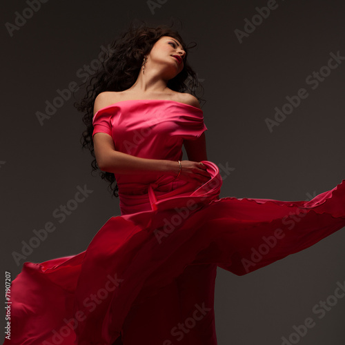 beautiful girl in a long pink dress