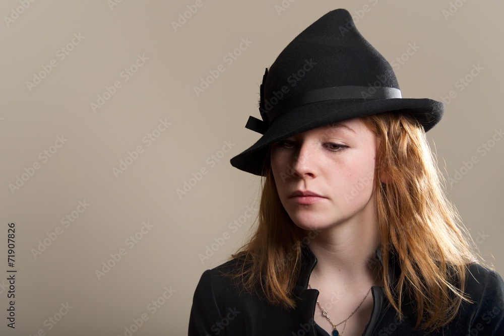 Redhead sad in black hat and jacket Redhead sad in black hat and jacket