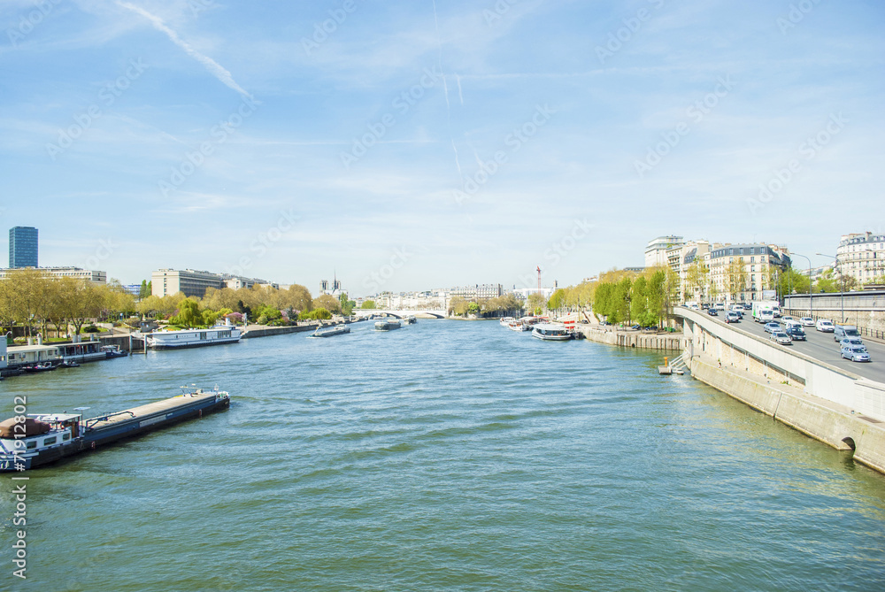 Canal of Paris with boats and trees with buildings Canal of Paris with boats and trees with buildings