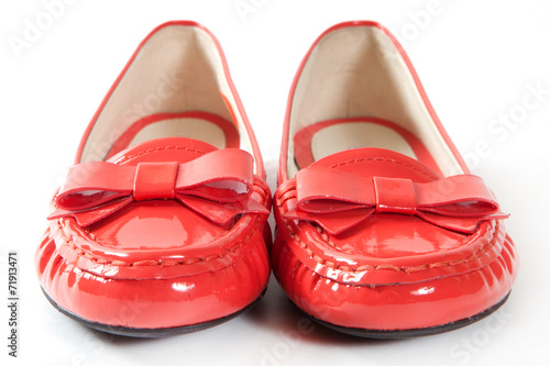Red female shoes on white background