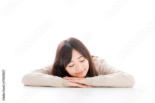 young asian woman relaxing on white background