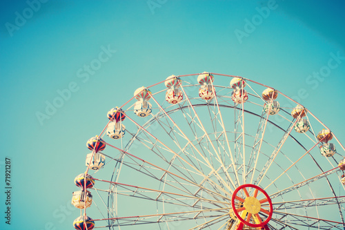 Summer ferris wheel over blue sky