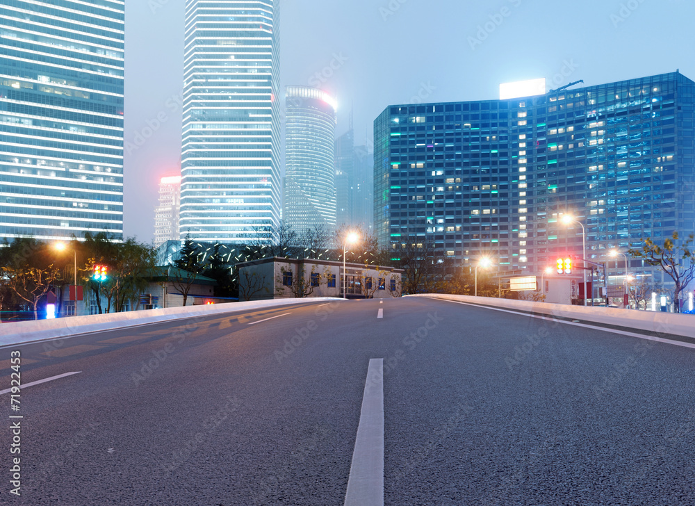 Naklejka premium Asphalt road and modern city