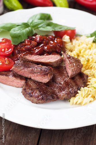 Beef steak with pasta and red beans