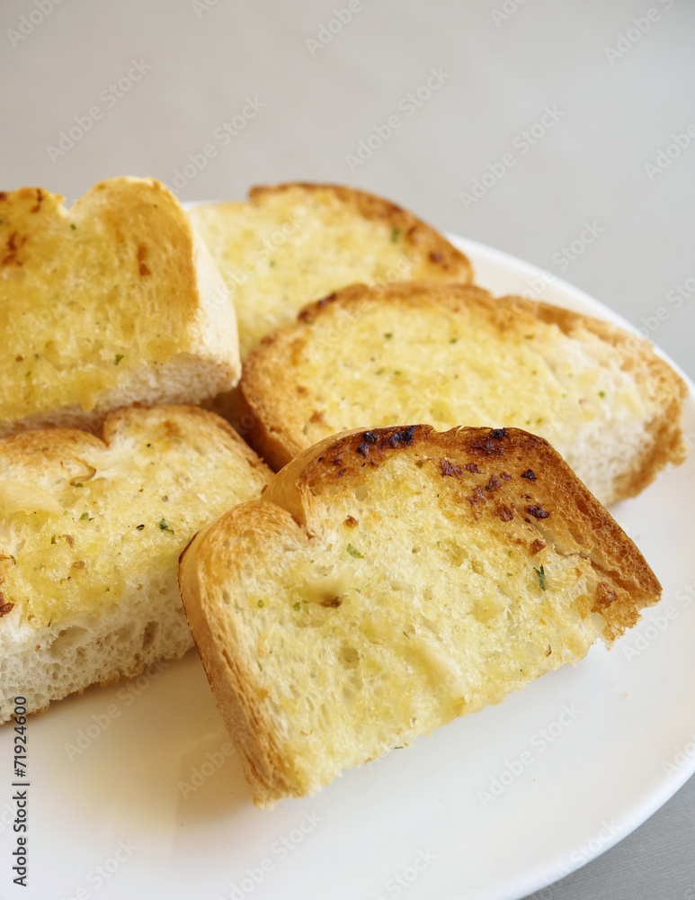 Garlic bread slices on plate Garlic bread slices on plate