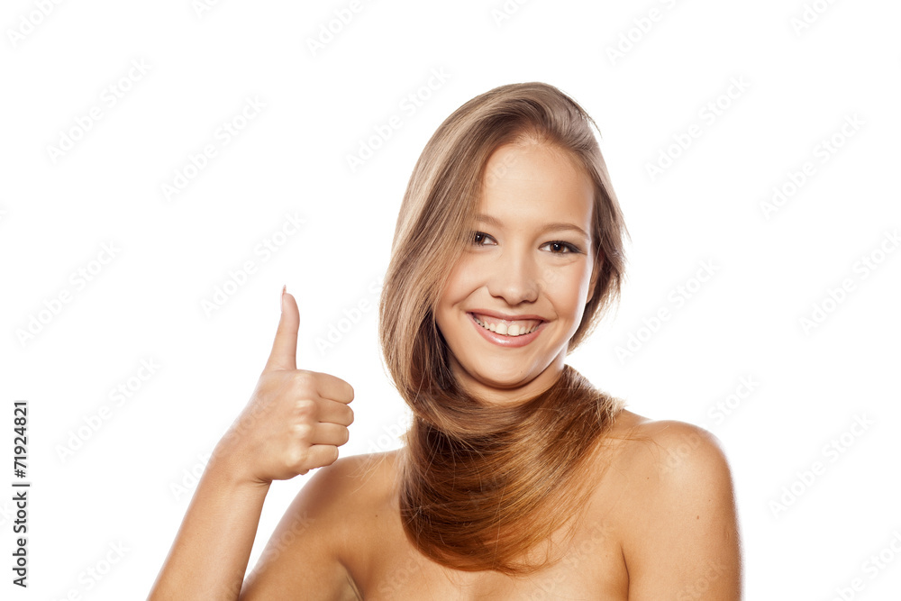 girl with long hair wrapped around her neck showing thumbs up girl with long hair wrapped around her neck showing thumbs up