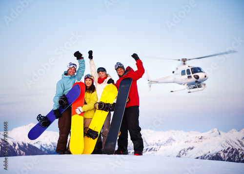 Snowboarders on Top of the Mountain with Heli Ski photo