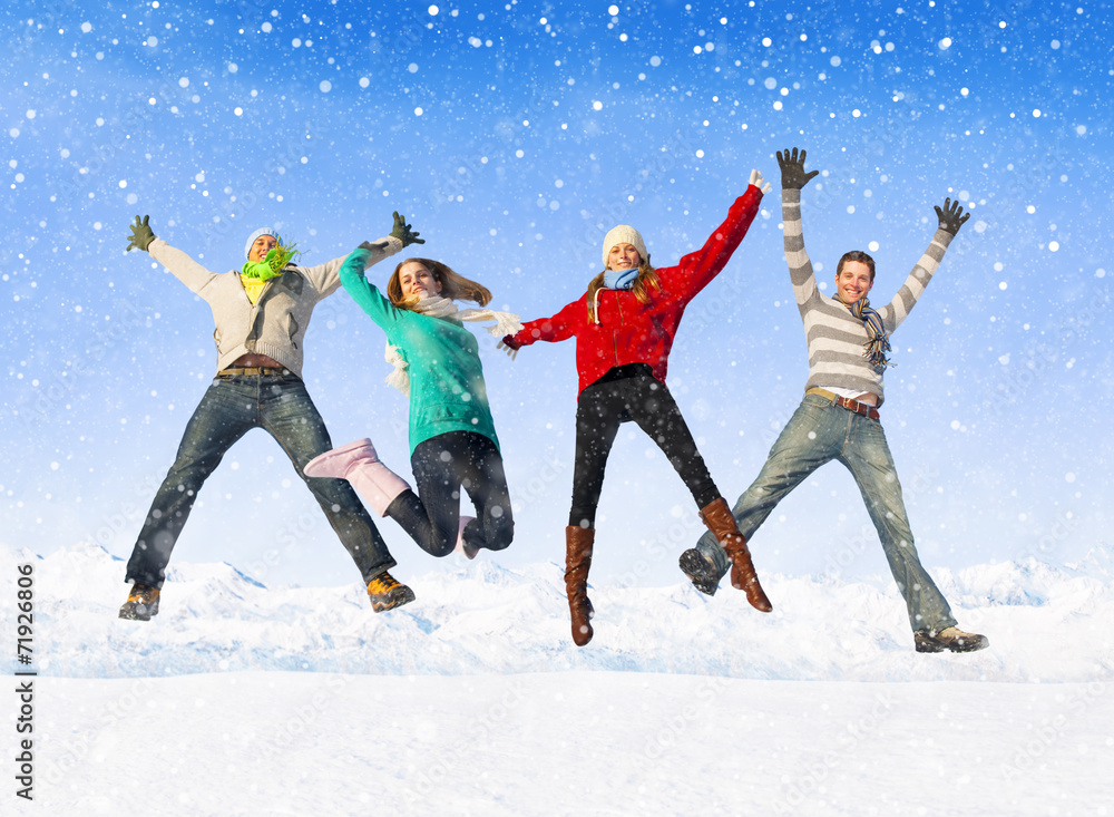 Group Of Friends Jumping in The Snow