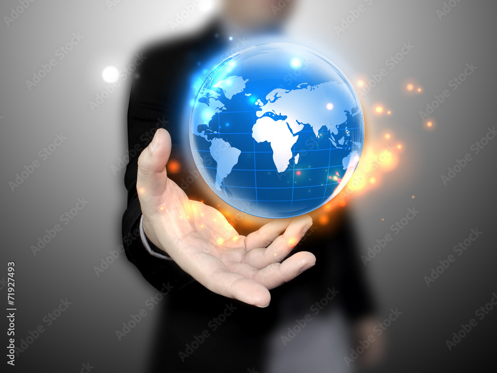 Businessman holding a globe Businessman holding a globe