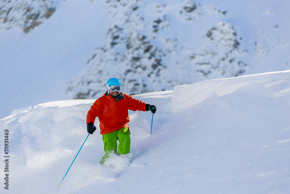 Skiing, Skier, Freeride in fresh powder snow - man skiing downhi