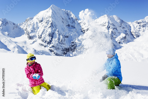 Ski and winter fun - skiers enjoying winter vacation
