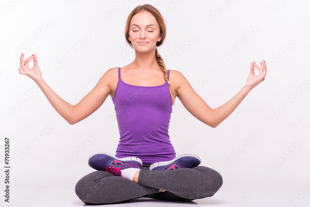 Healthy young sportswoman does the exercises Healthy young sportswoman does the exercises