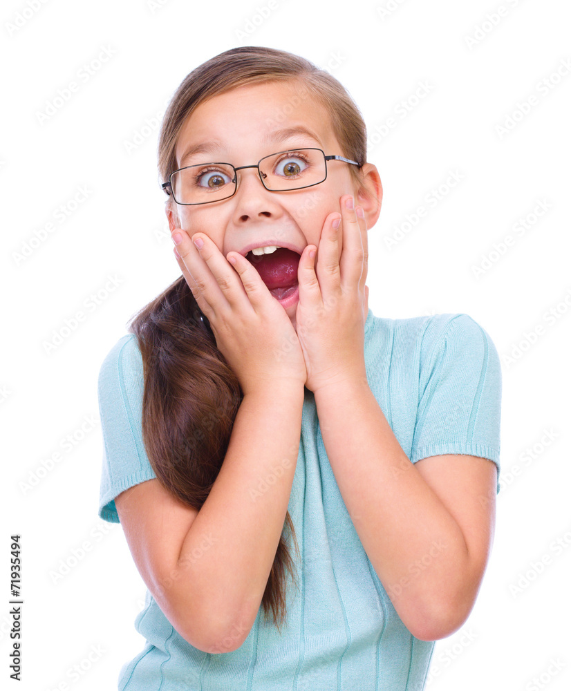 Cute girl is holding her face in astonishment Cute girl is holding her face in astonishment