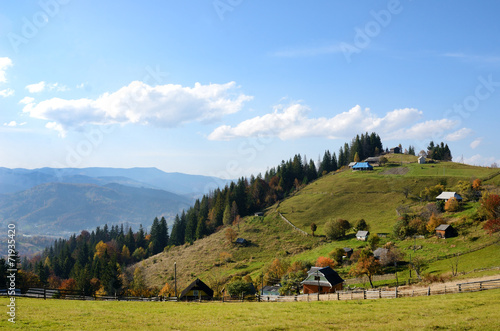 Picturesque autumn rural landscape on a background of blue sky w © anko_ter
