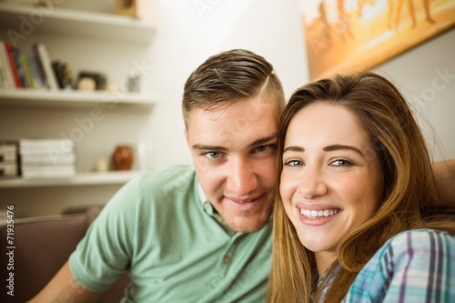 Cute couple relaxing on couch