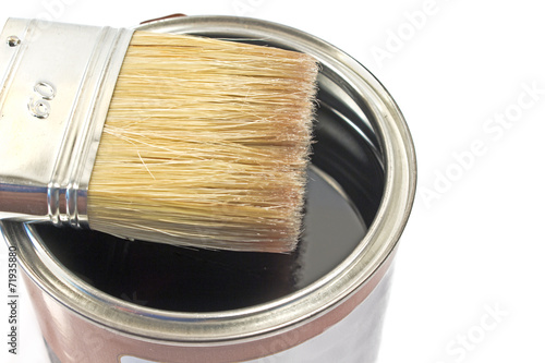 Foto Paint brush and varnish can on white