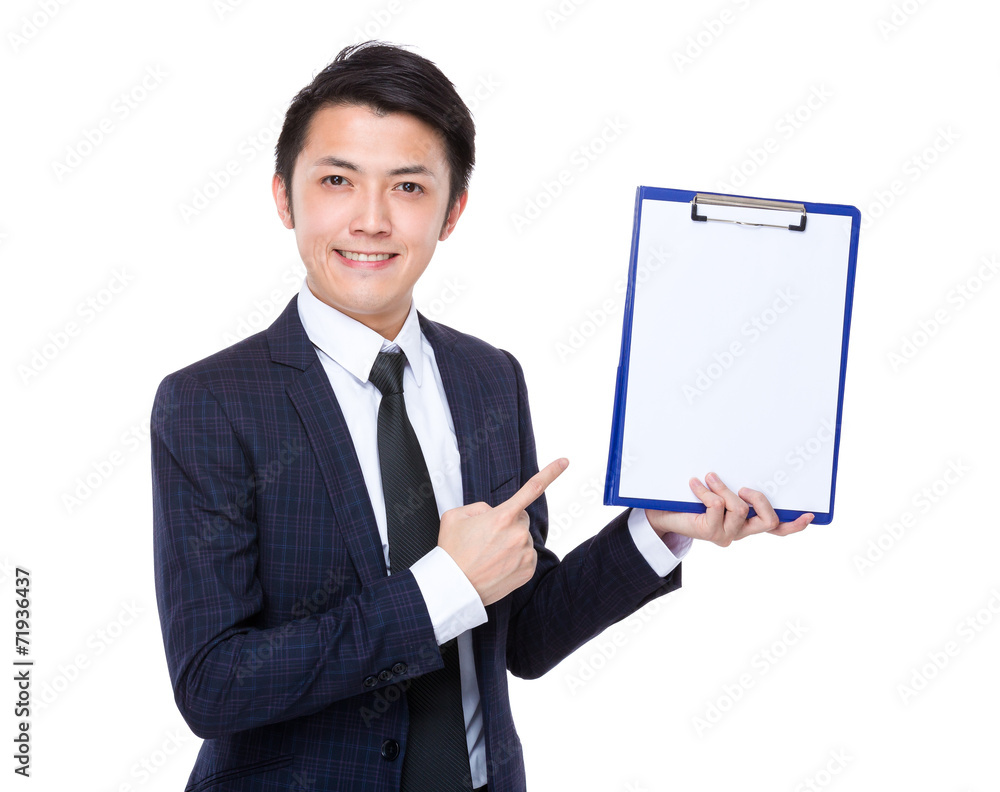 Businessman finger point to blank page of clipboard Businessman finger point to blank page of clipboard