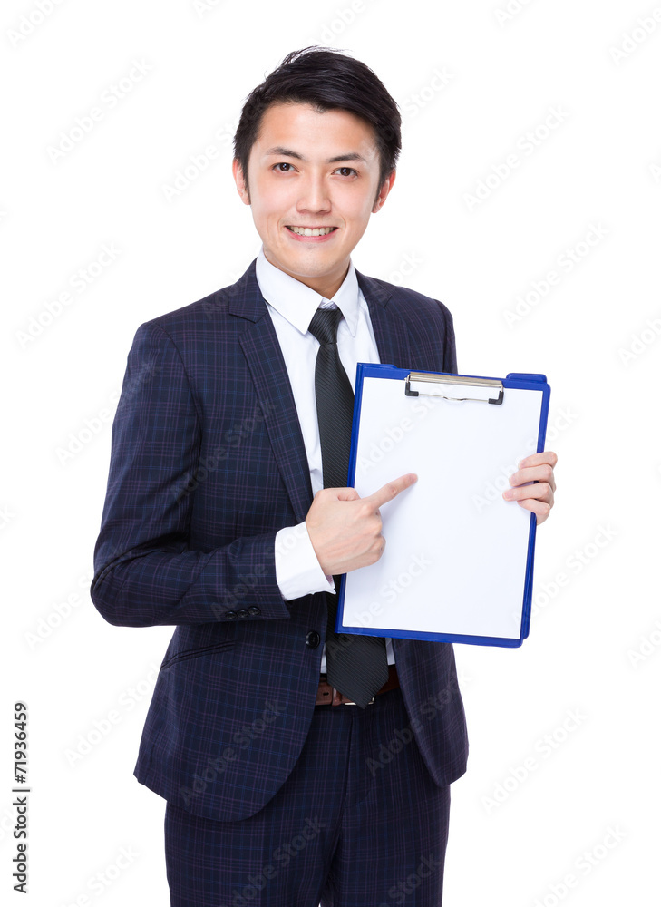 Businessman finger point to white paper of clipboard Businessman finger point to white paper of clipboard