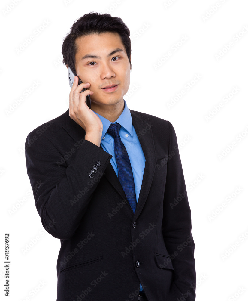 Businessman talk to mobile phone Businessman talk to mobile phone