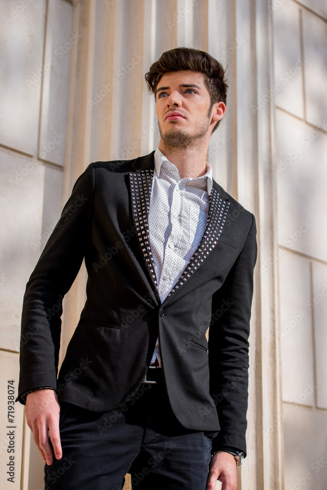 Attractive man standing in a black jacket Attractive man standing in a black jacket
