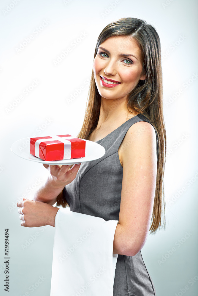 Smiling business woman hold red gift on a plate. Smiling business woman hold red gift on a plate.