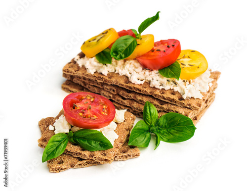 rye bread with cheese, tomatoes, basil and thyme