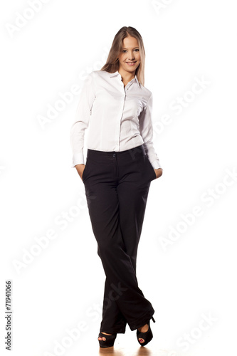young business woman with long hair posing on white