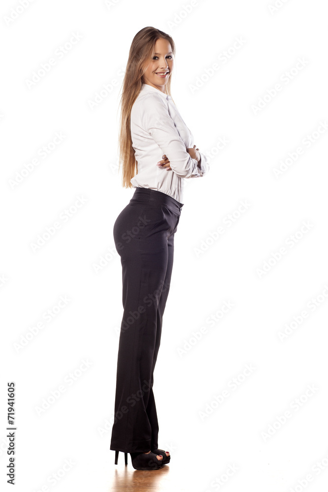young business woman with long hair posing with crossed arms young business woman with long hair posing with crossed arms