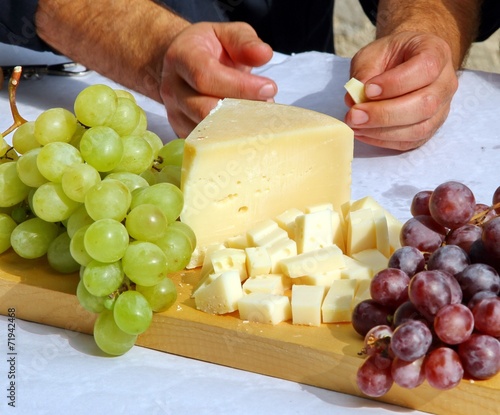 Asiago cheese and black grapes and white grape photo