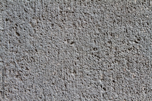Fototapeta Zbliżenie szorstkiej, ciemnoszarej betonowej ściany