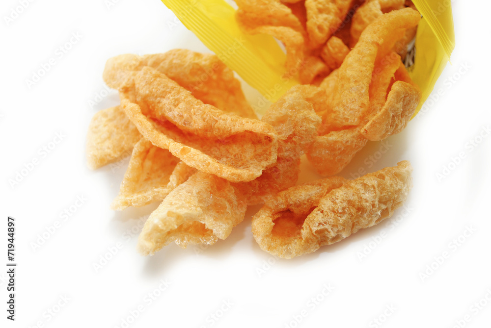 Unhealthy Pork Rinds Falling out of a Bag Unhealthy Pork Rinds Falling out of a Bag