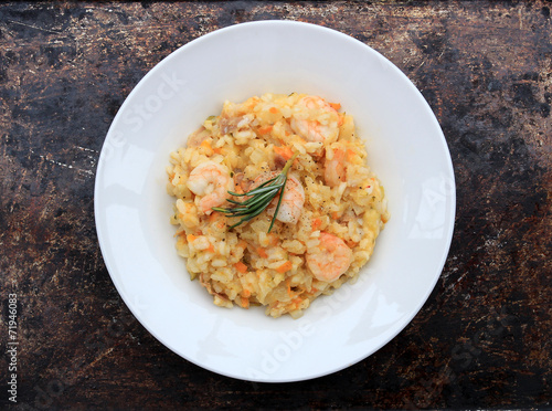Risotto with shrimps, prosciutto and various vegetables