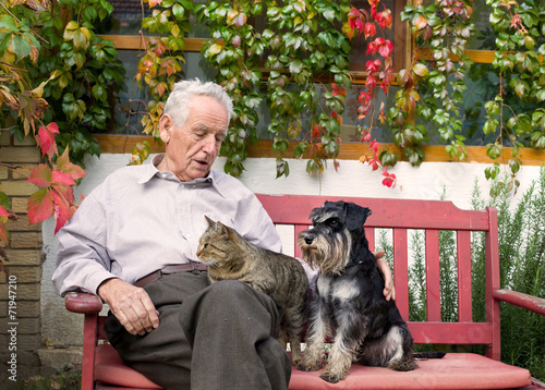 Senior man with pets photo