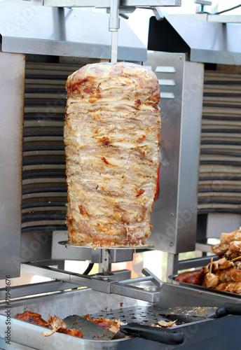 Kebab meat cooked in the special vertical oven photo