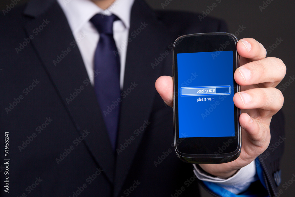 mobile phone loading in business man hand mobile phone loading in business man hand