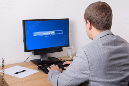 business man downloading something from internet using personal