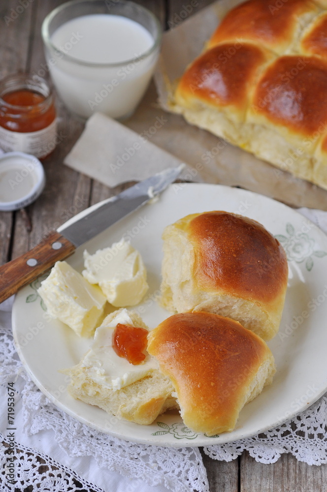 Homemade dinner rolls with butter and jam, selective focus Homemade dinner rolls with butter and jam, selective focus