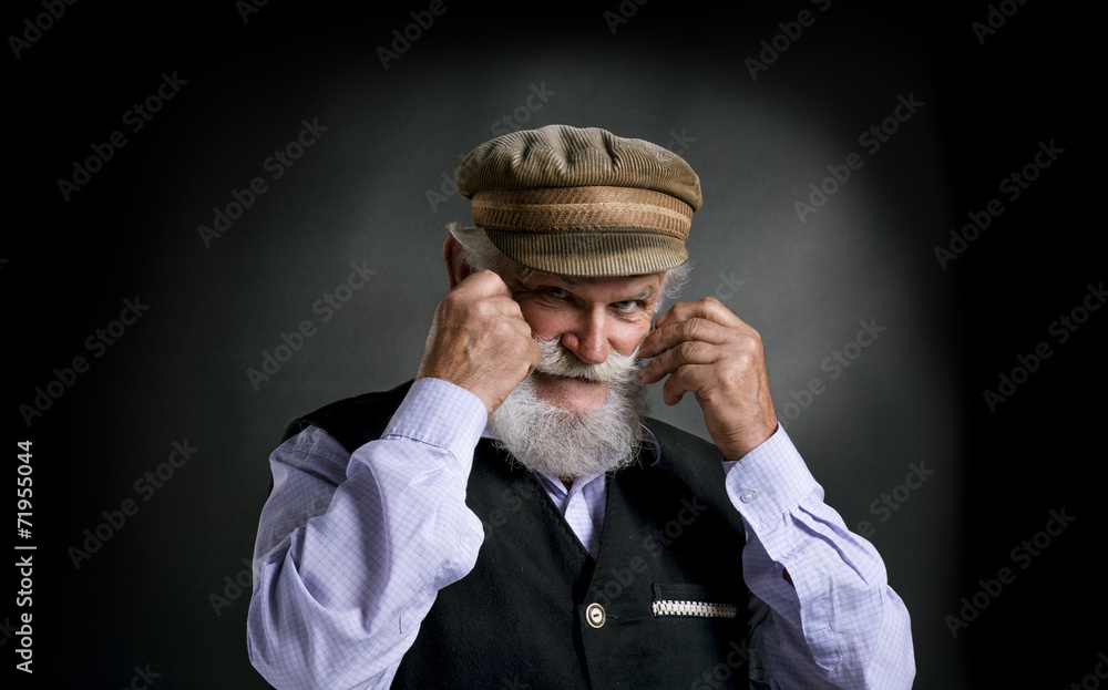Old man in cap on black background Old man in cap on black background