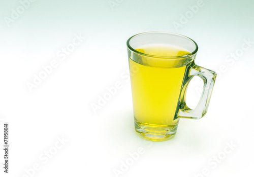 tea in a transparent cup on white background