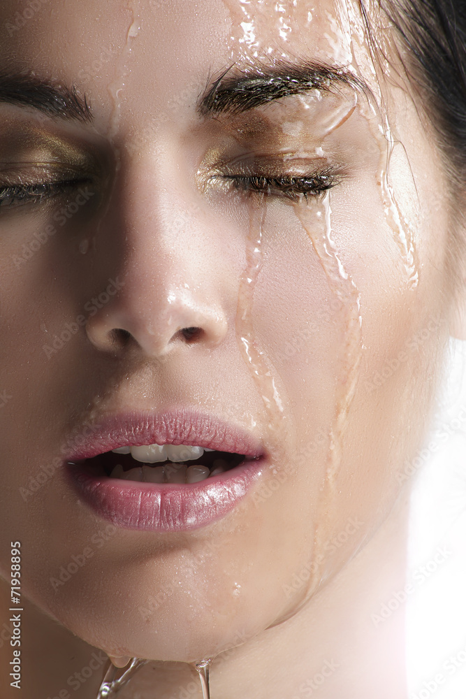waterfall on a beautiful face close up waterfall on a beautiful face close up