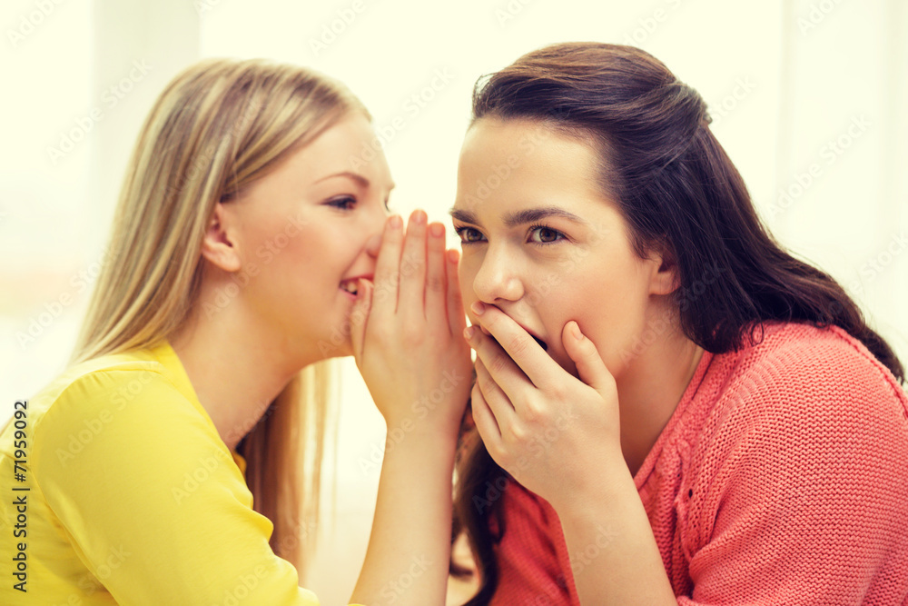 one girl telling another secret one girl telling another secret