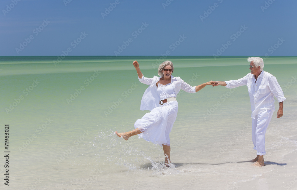 Happy Senior Couple Dancing Holding Hands on A Tropical Beach Happy Senior Couple Dancing Holding Hands on A Tropical Beach