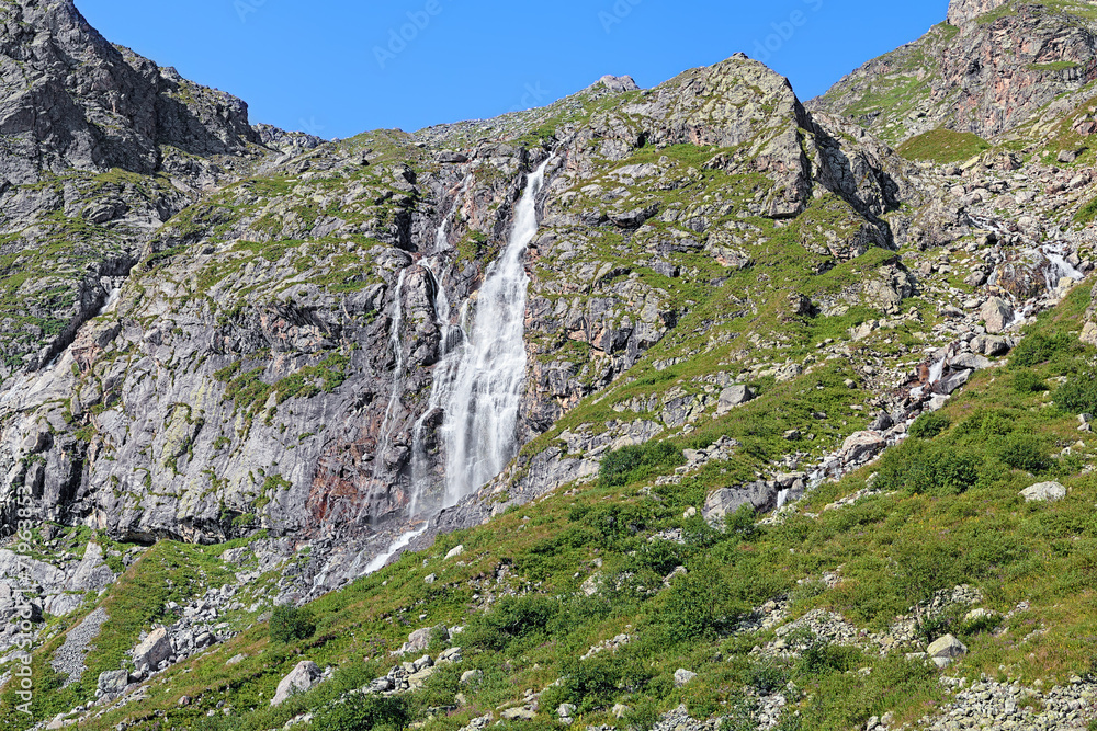Fototapeta premium Waterfall at the riverhead of Bilyagidon river, Caucasus, Russia